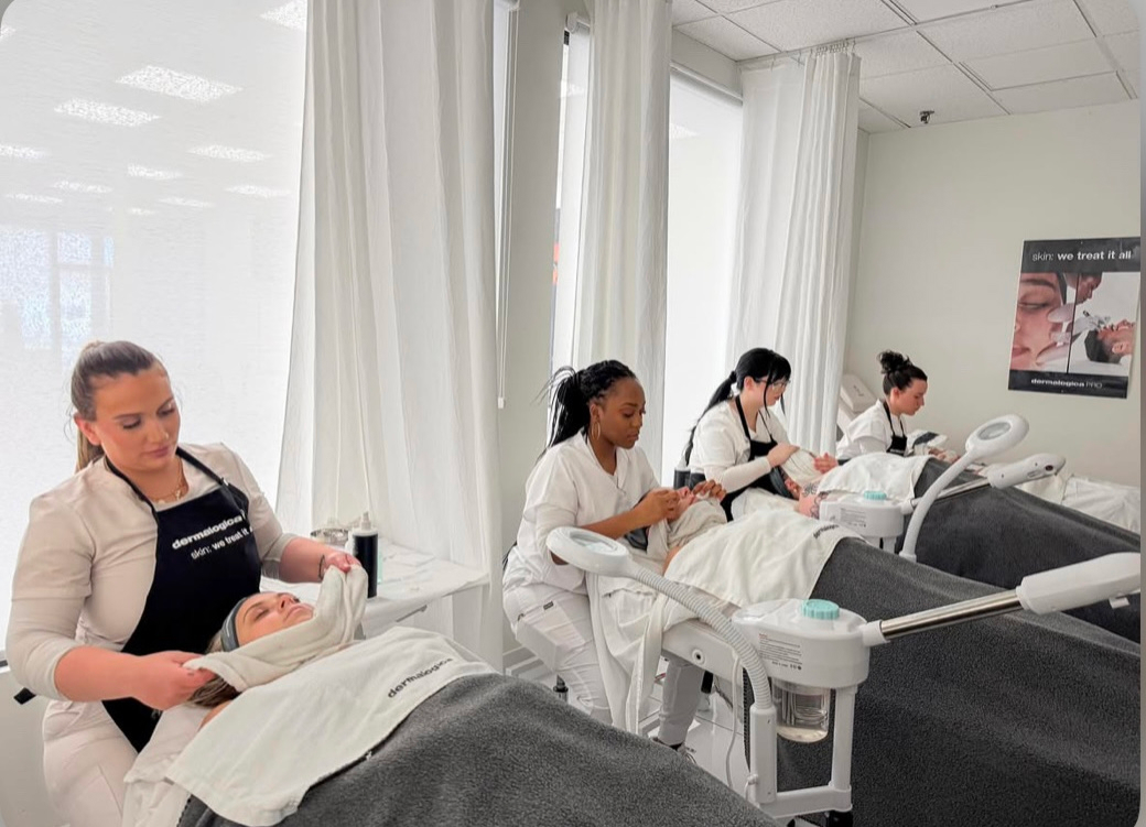 Students performing facial services